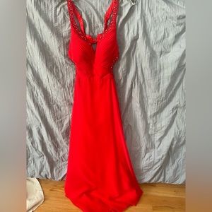 Beautiful open back red prom dress. Detailing is beautiful and only worn twice.